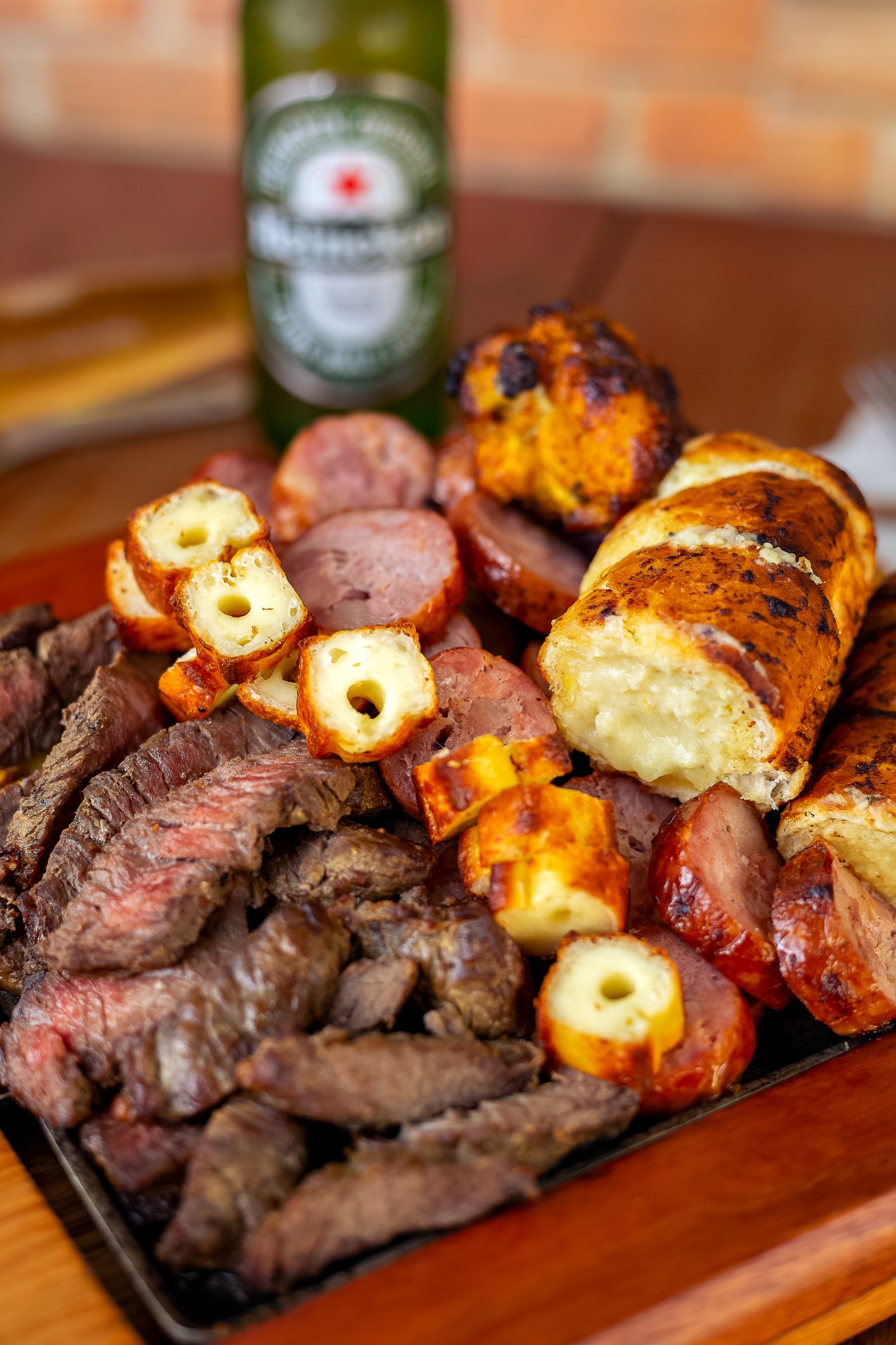 Smoked products arranged on a wooden serving board